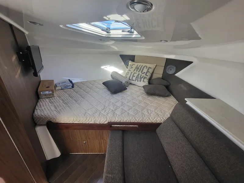 Slide: The Image of Cozy cabin interior of 2018 Everglades 360 LXC with bed and seating area. - 23
