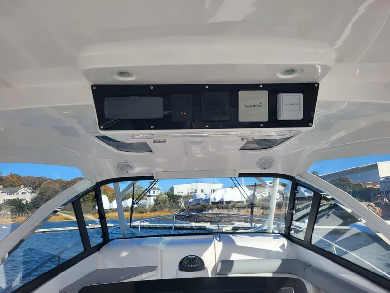 Slide: The Image of Interior view of 2018 Everglades 360 LXC boat with navigation equipment. - 3