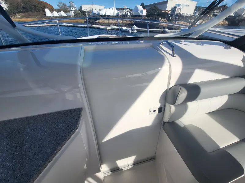 Slide: The Image of 2018 Everglades 360 LXC boat interior with seating and water view. - 32