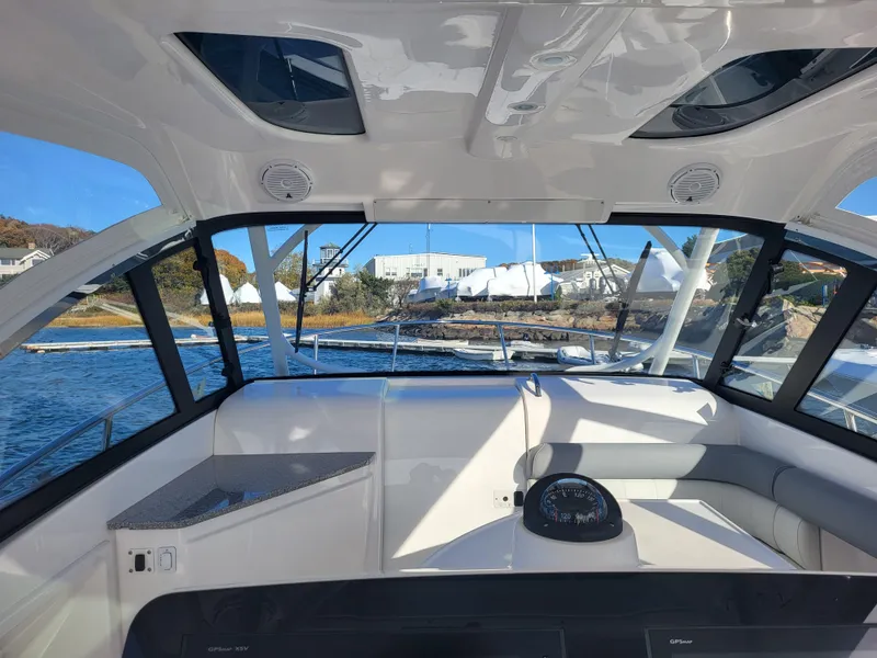 Slide: The Image of Interior view of 2018 Everglades 360 LXC boat with panoramic windows. - 33