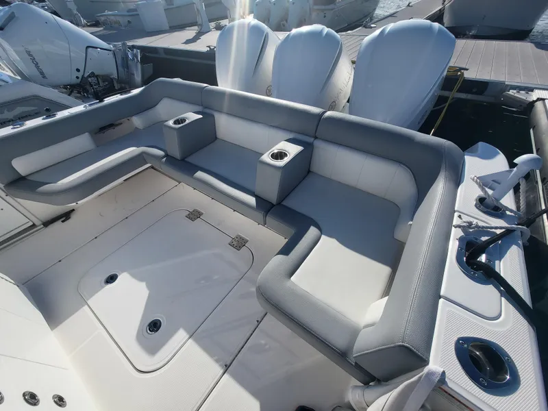 Slide: The Image of 2018 Everglades 360 LXC boat with spacious seating and cup holders. - 45