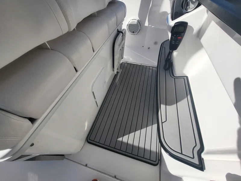 Slide: The Image of 2018 Everglades 360 LXC boat interior with cushioned seating and non-slip flooring. - 48