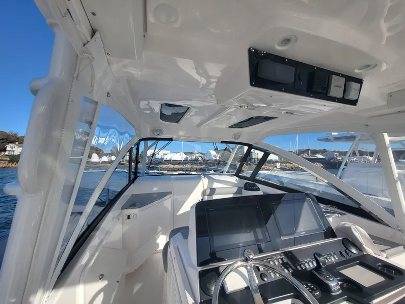 Slide: The Image of Interior view of 2018 Everglades 360 LXC boat cockpit with advanced navigation system. - 5