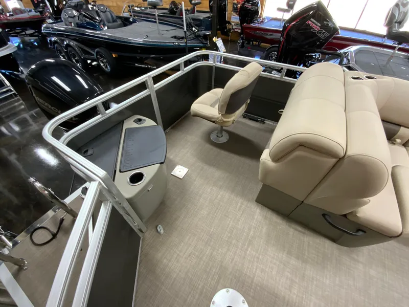 Slide: The Image of 2024 Sun Tracker Fishin' Barge 20 DLX interior with seating and fishing station. - 10