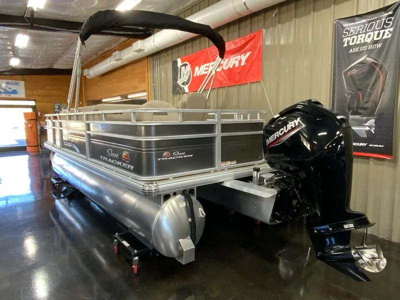Slide: The Image of 2024 Sun Tracker Fishin' Barge 20 DLX pontoon boat with Mercury outboard motor. - 3