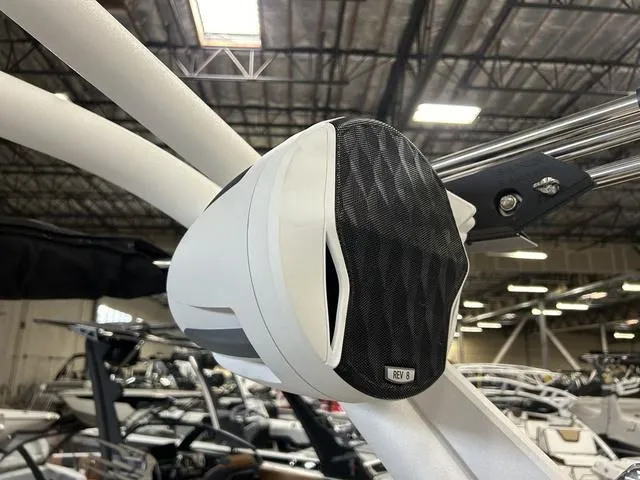 Slide: The Image of 2024 Malibu 22 LSV boat speaker in a showroom. - 11