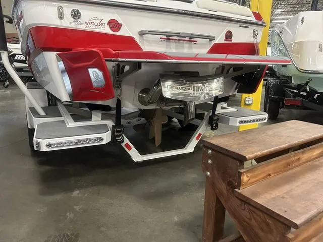 Slide: The Image of 2024 Malibu 22 LSV boat rear view in showroom. - 13