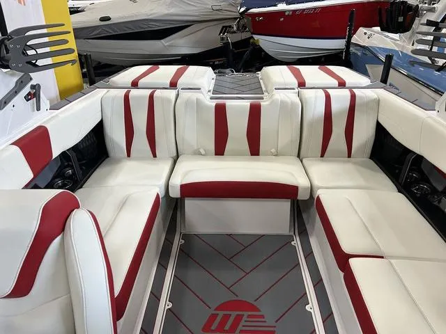 Slide: The Image of 2024 Malibu 22 LSV boat interior with white and red seating. - 3