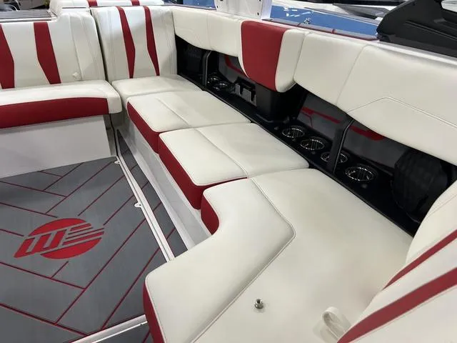 Slide: The Image of 2024 Malibu 22 LSV boat interior with white and red seating. - 5