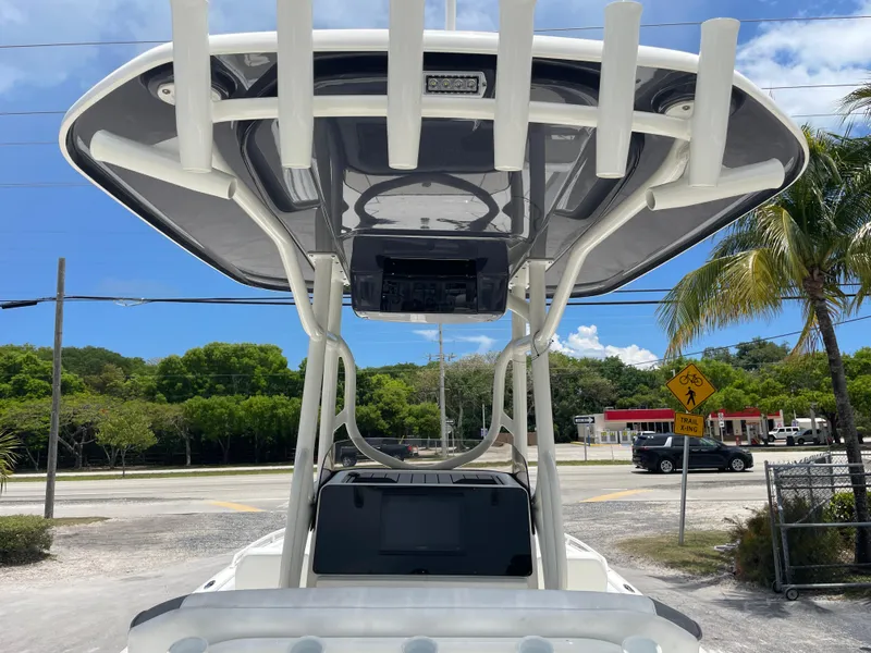 Slide: The Image of 2022 Skeeter 2550 Family boat with T-top and rod holders. - 10