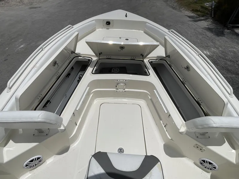 Slide: The Image of 2022 Skeeter 2550 Family boat with open storage compartments and seating. - 14