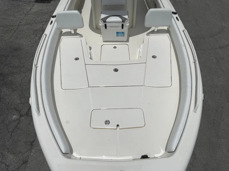 Slide: The Image of 2022 Skeeter 2550 Family boat deck with storage compartments and seating. - 15
