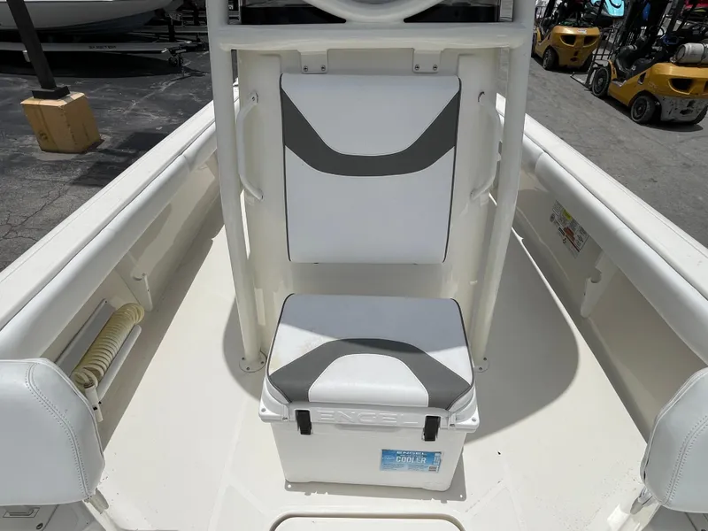 Slide: The Image of 2022 Skeeter 2550 Family boat interior with cushioned seating and storage. - 17