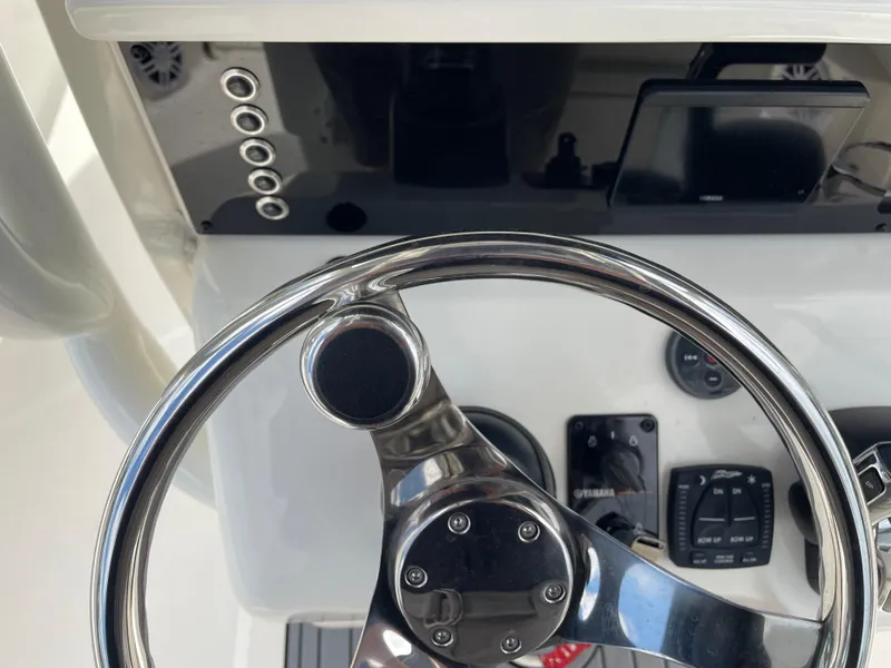 Slide: The Image of Steering console of 2022 Skeeter 2550 Family boat with controls and display. - 23