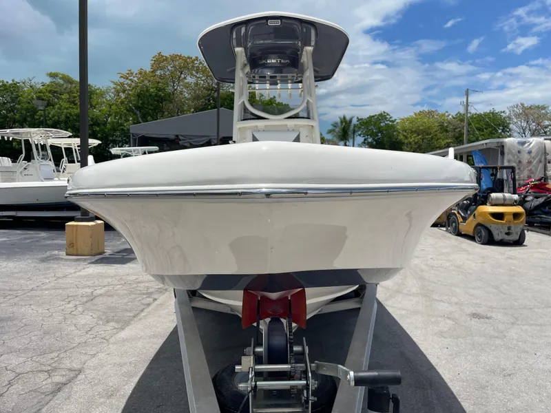 Slide: The Image of 2022 Skeeter 2550 Family boat on trailer, front view, outdoor display. - 3
