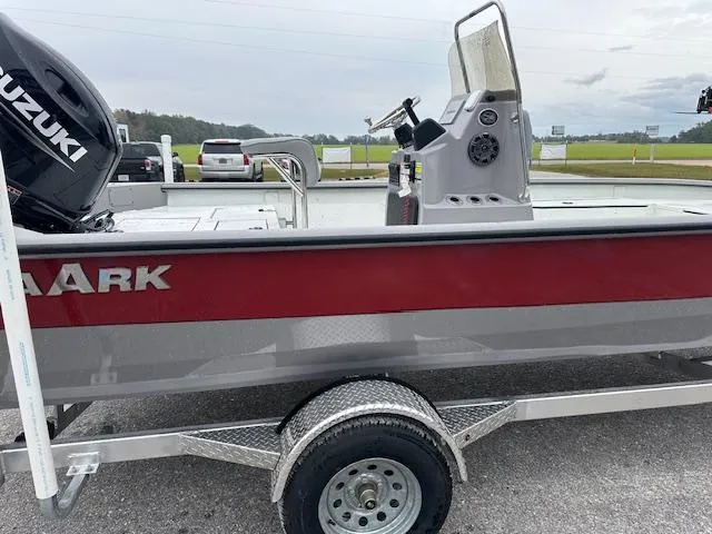 Slide: The Image of 2024 SeaArk Bay Runner 210 boat on trailer with Suzuki outboard motor. - 10