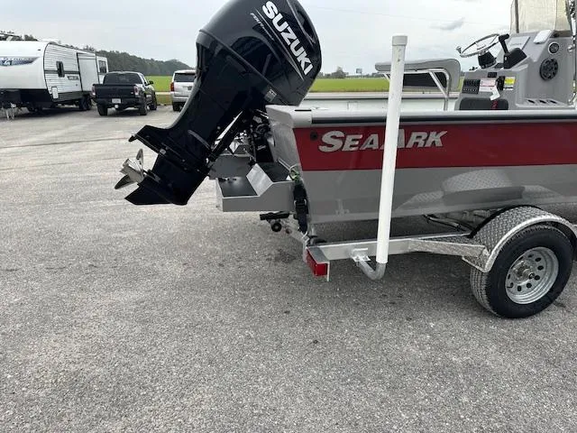 Slide: The Image of 2024 SeaArk Bay Runner 210 with Suzuki outboard motor on trailer. - 11