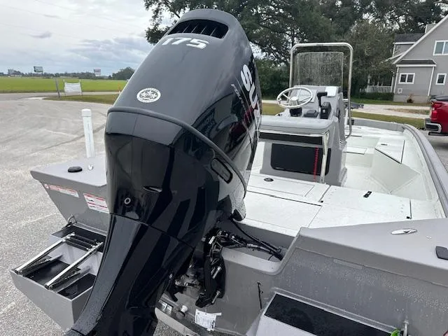 Slide: The Image of 2024 SeaArk Bay Runner 210 boat with 115 HP outboard motor, rear view. - 13