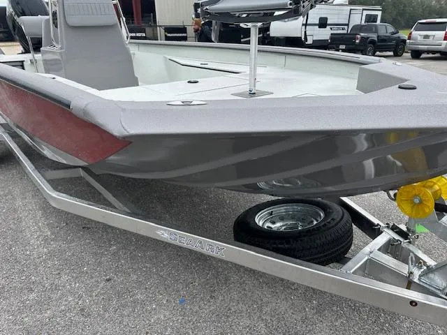Slide: The Image of 2024 SeaArk Bay Runner 210 boat on a trailer, close-up view. - 9