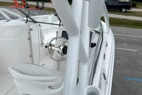 Slide: The Image of 2024 Sea Fox 228 Traveler boat interior with steering wheel and seating. - 12