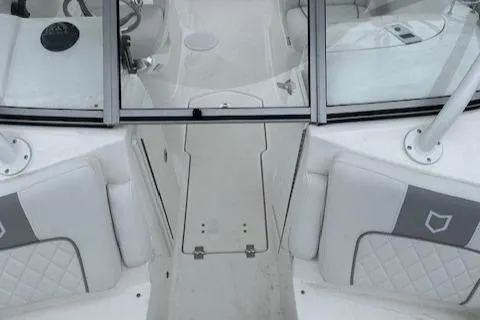 Slide: The Image of 2024 Sea Fox 228 Traveler boat interior with white and gray seating. - 8