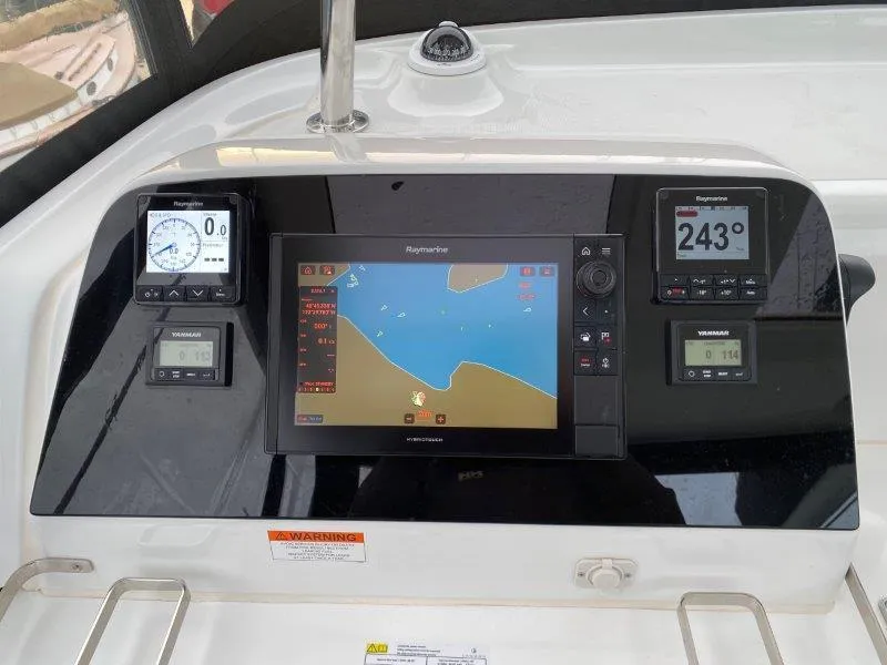 Slide: The Image of Lagoon 42 2024 yacht navigation dashboard with Raymarine instruments and digital display. - 28