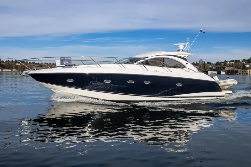 Slide: The Image of 2007 Sunseeker Portofino 47 yacht cruising on calm waters. - 1