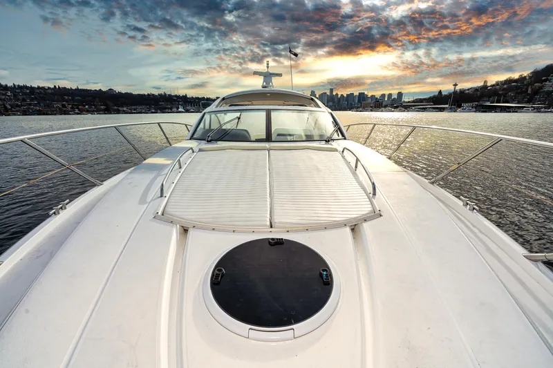 Slide: The Image of 2007 Sunseeker Portofino 47 yacht on water at sunset. - 11