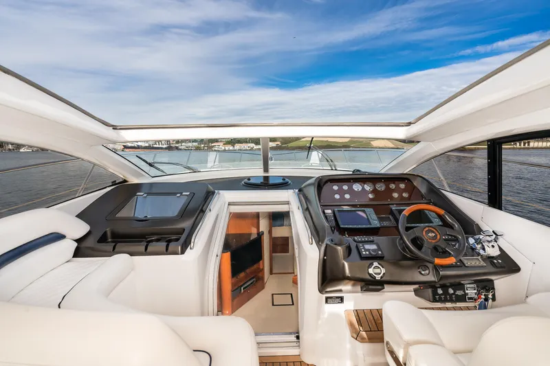 Slide: The Image of 2007 Sunseeker Portofino 47 yacht cockpit with modern navigation equipment and luxurious interior. - 15