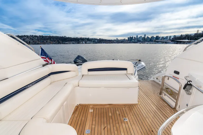 Slide: The Image of 2007 Sunseeker Portofino 47 yacht with spacious deck and scenic waterfront view. - 22