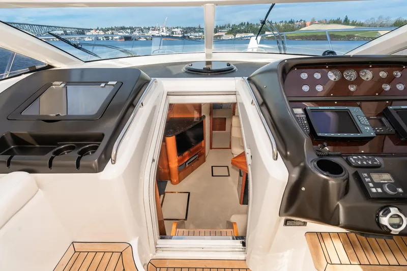 Slide: The Image of Sunseeker Portofino 47 yacht interior, 2007 model, cockpit view with navigation controls. - 24