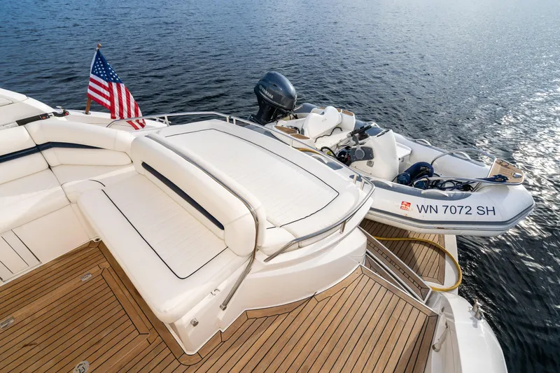 Slide: The Image of 2007 Sunseeker Portofino 47 yacht with tender boat on water. - 25
