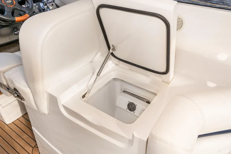 Slide: The Image of Sunseeker Portofino 47 2007 yacht interior storage compartment with white cushioned seating. - 27