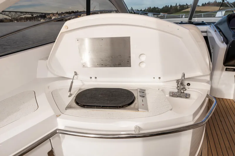 Slide: The Image of 2007 Sunseeker Portofino 47 yacht outdoor grill station with scenic water view. - 28