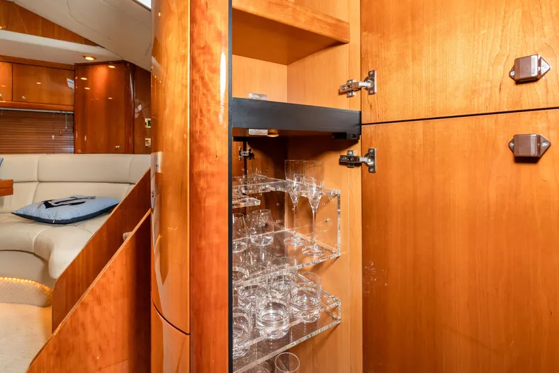 Slide: The Image of Luxurious interior of 2007 Sunseeker Portofino 47 yacht with glassware cabinet. - 32