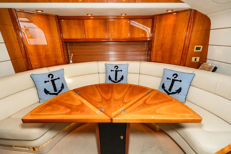 Slide: The Image of Luxurious interior of 2007 Sunseeker Portofino 47 yacht with wooden table and anchor-themed cushions. - 37
