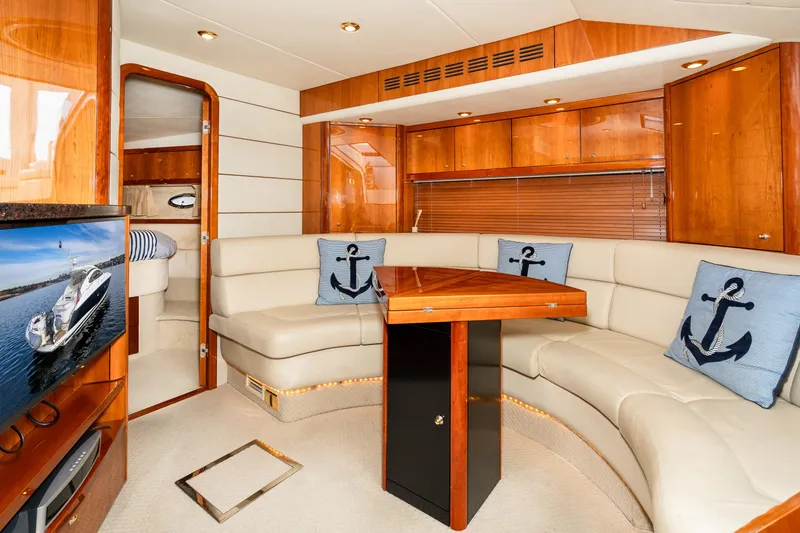 Slide: The Image of Luxurious interior of 2007 Sunseeker Portofino 47 yacht with leather seating and wooden finishes. - 38