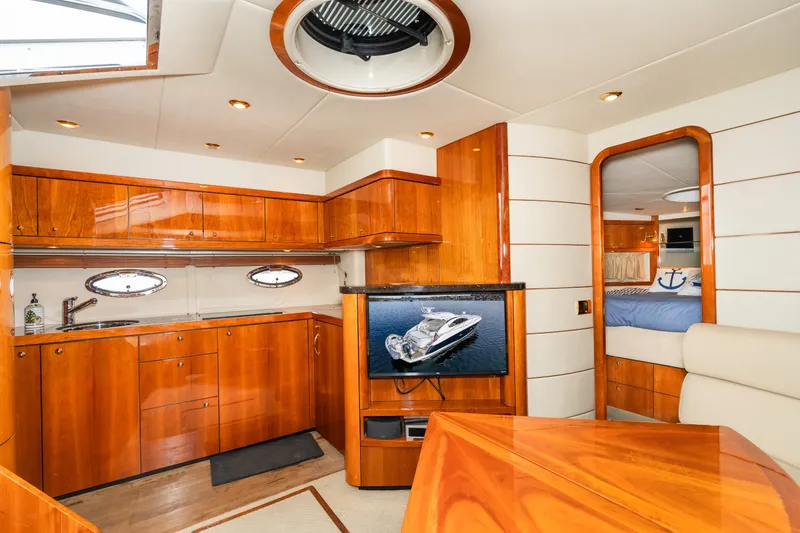 Slide: The Image of Luxurious interior of 2007 Sunseeker Portofino 47 yacht with wooden cabinetry and modern amenities. - 39