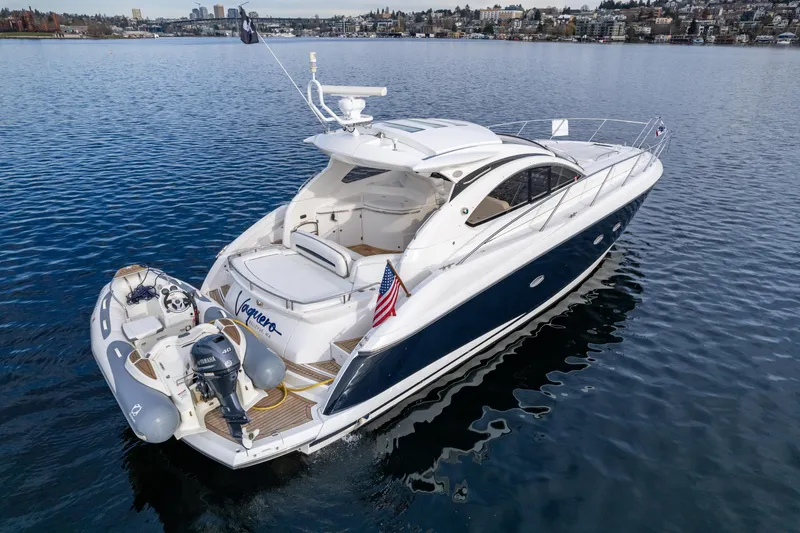 Slide: The Image of 2007 Sunseeker Portofino 47 yacht on calm water, rear view. - 4