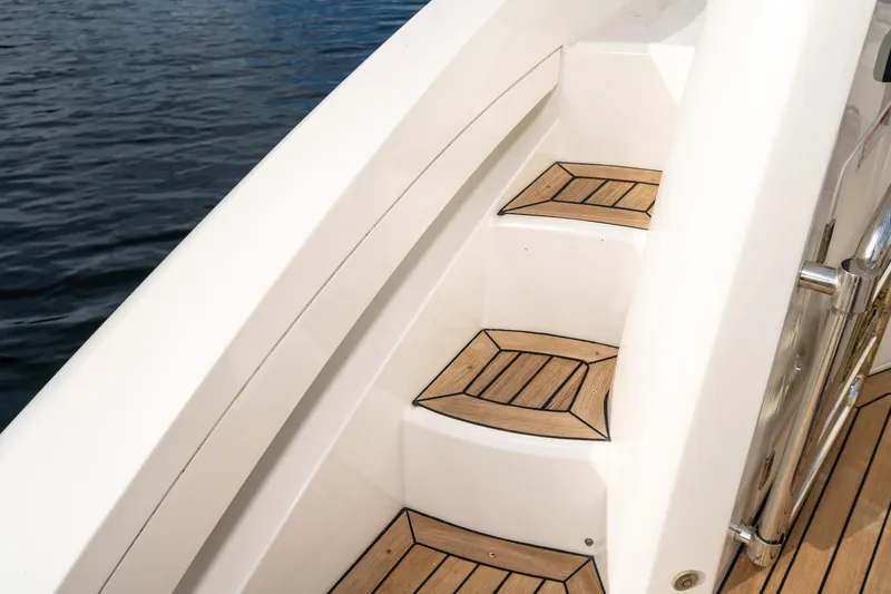 Slide: The Image of Teak steps on a 2007 Sunseeker Portofino 47 yacht. - 49