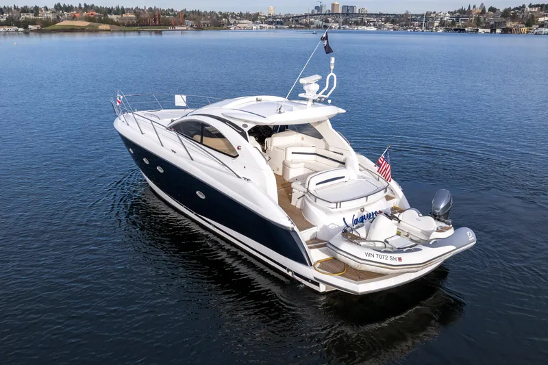 Slide: The Image of 2007 Sunseeker Portofino 47 yacht cruising on a calm lake. - 8