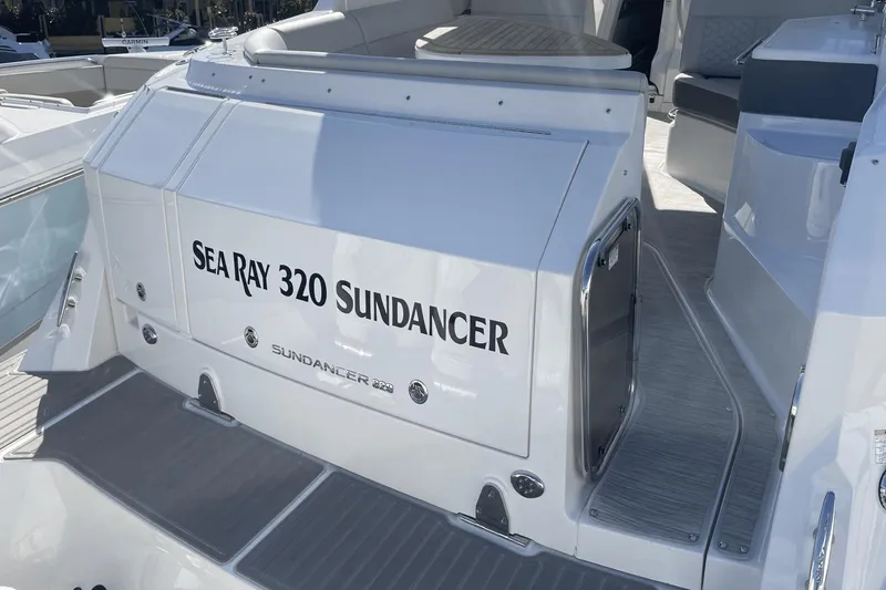 Slide: The Image of 2024 Sea Ray Sundancer 320 Outboard boat interior, showcasing sleek design and spacious seating. - 3