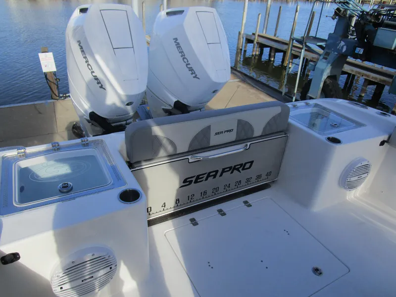 Slide: The Image of 2024 Sea Pro 322 Offshore boat with dual Mercury engines at dock. - 10