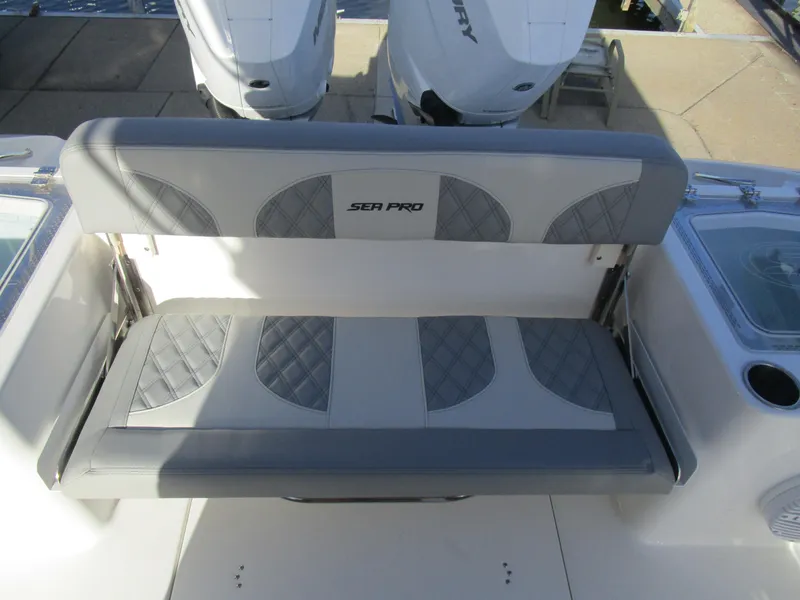 Slide: The Image of 2024 Sea Pro 322 Offshore boat seating with dual Mercury engines. - 11