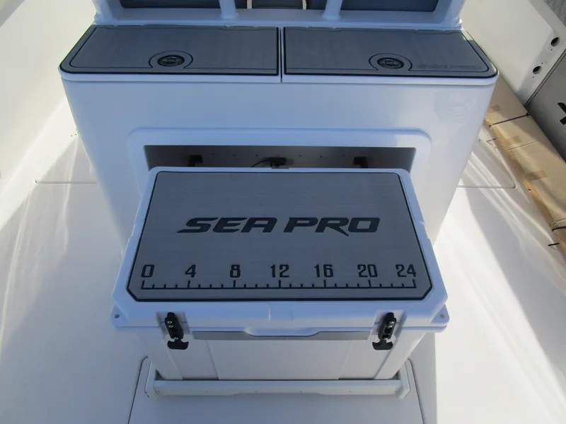 Slide: The Image of 2024 Sea Pro 322 Offshore boat with integrated cooler and storage compartments. - 16