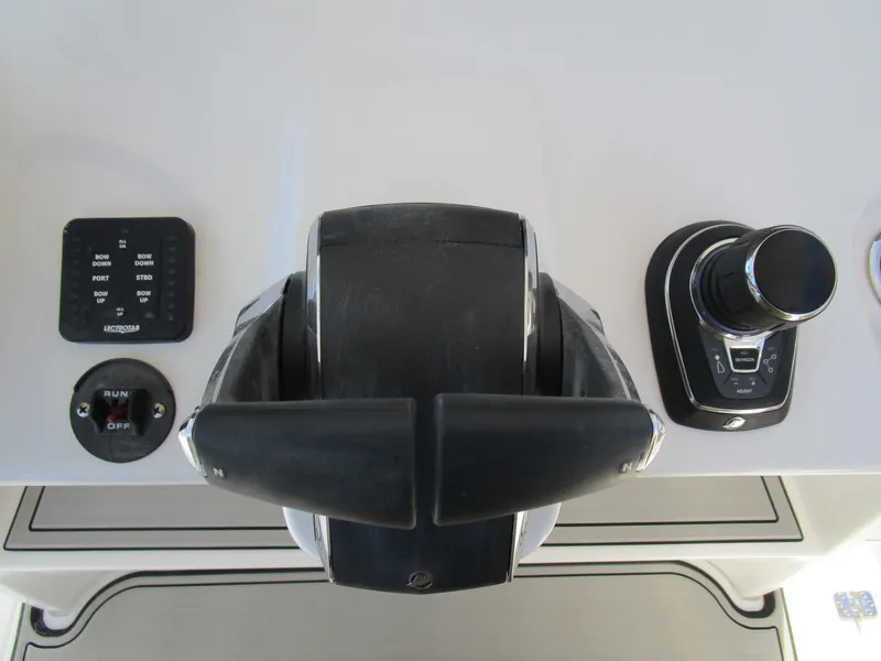 Slide: The Image of 2024 Sea Pro 322 Offshore boat controls and dashboard. - 22