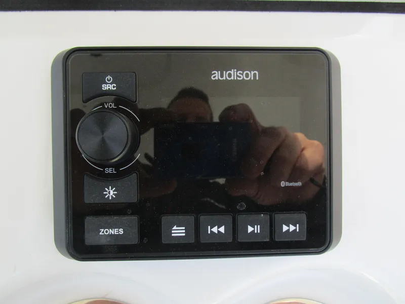 Slide: The Image of Audison audio control panel on 2024 Sea Pro 322 Offshore boat. - 23