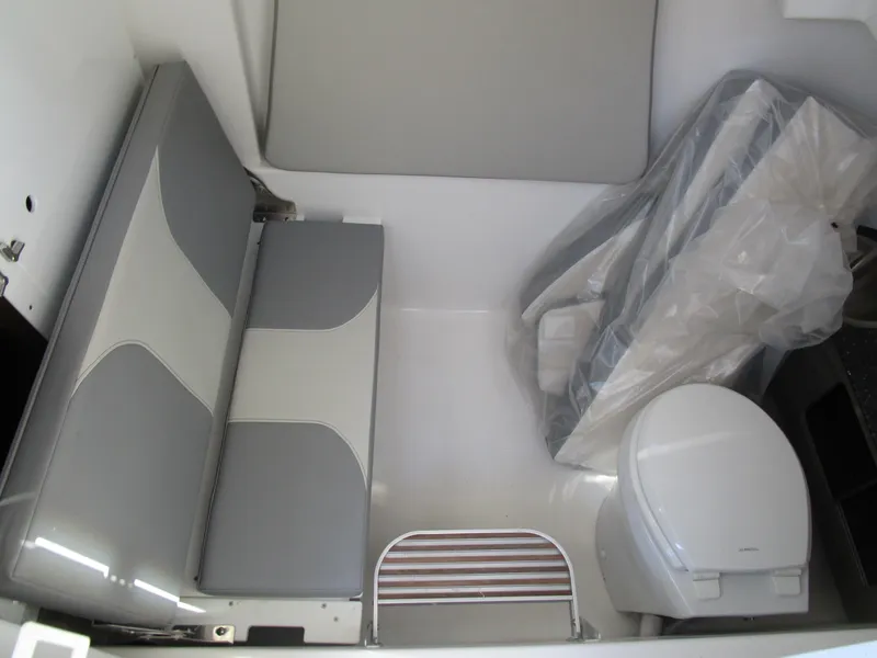 Slide: The Image of 2024 Sea Pro 322 Offshore boat interior with seating and toilet. - 28