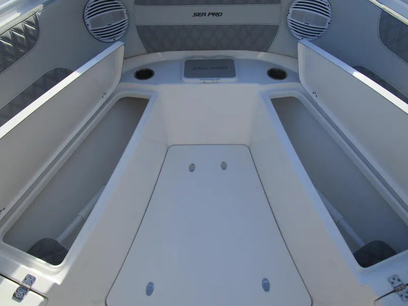 Slide: The Image of 2024 Sea Pro 322 Offshore boat interior with open storage compartments. - 33