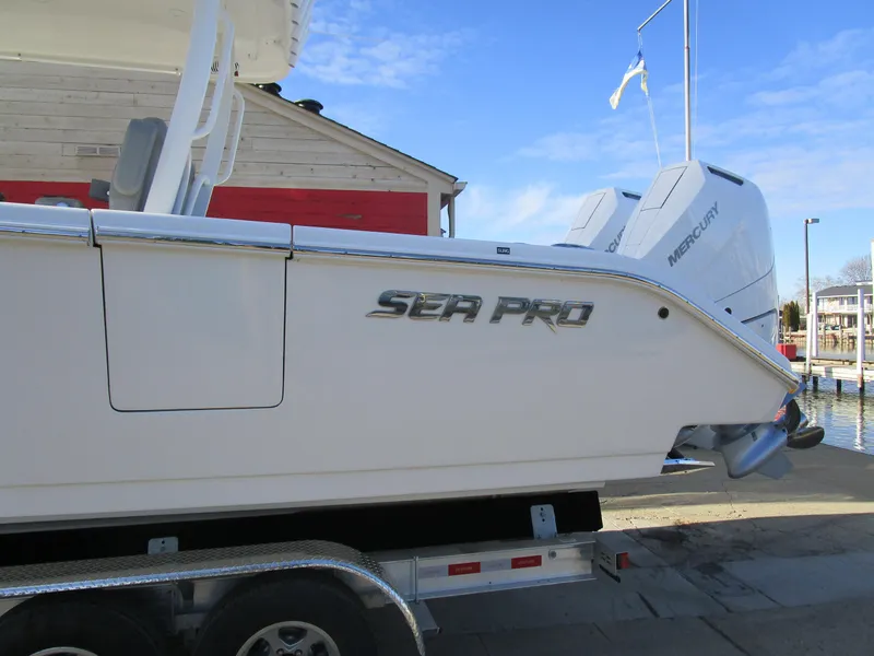 Slide: The Image of 2024 Sea Pro 322 Offshore boat on trailer with Mercury engines. - 4